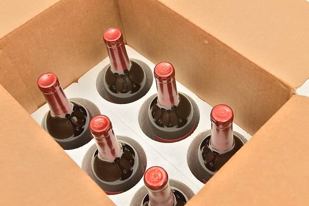 Wine bottles secured in a shipping box